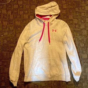 Light grey Under Armor sweatshirt with pockets and hood. Adjustable drawstrings